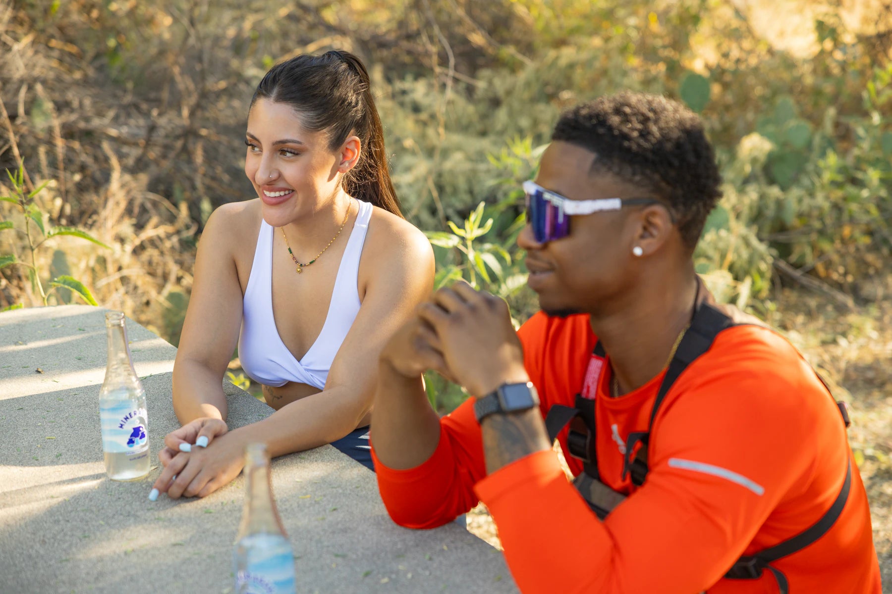 Two people taking a break after an outdoor workout